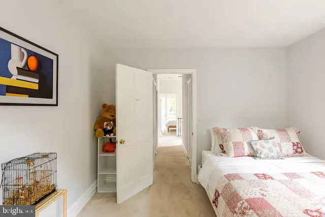 a bedroom with a bed and a couch