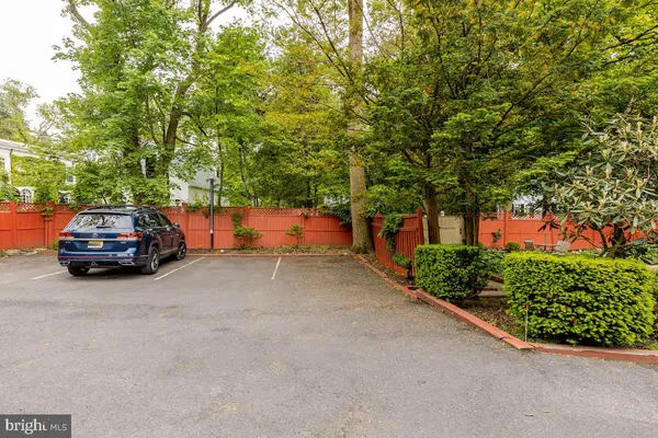 a house view with a car parked in front of it