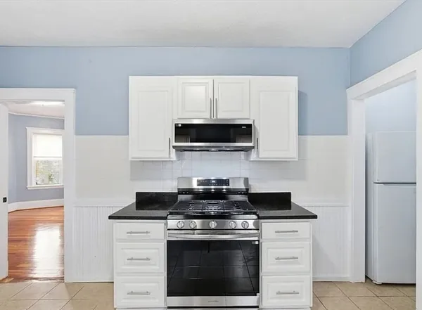 a kitchen with a stove and a microwave