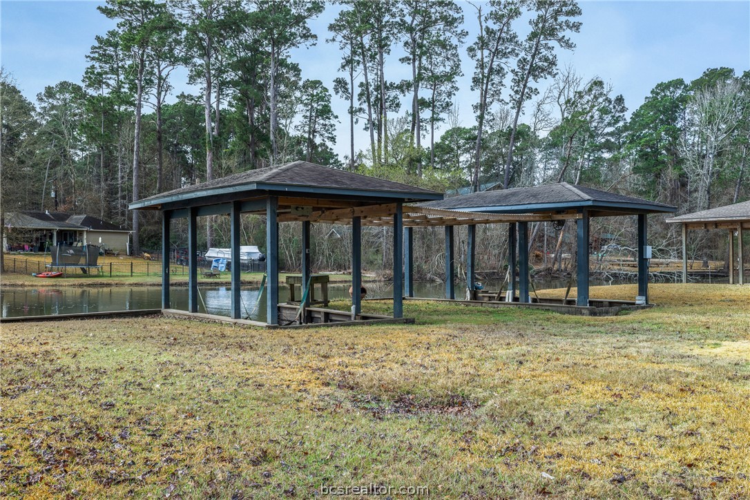 70 Lakeside Drive Trinity, TX 75862 - Photo 4 of 34 a view of a house with backyard outdoor seating and yard