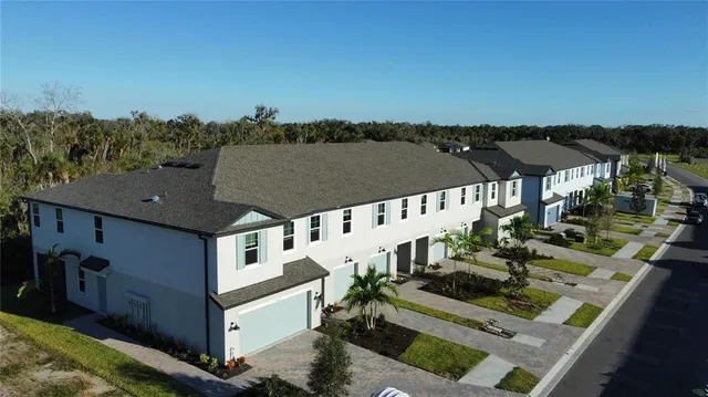 an aerial view of a house with a mountain view