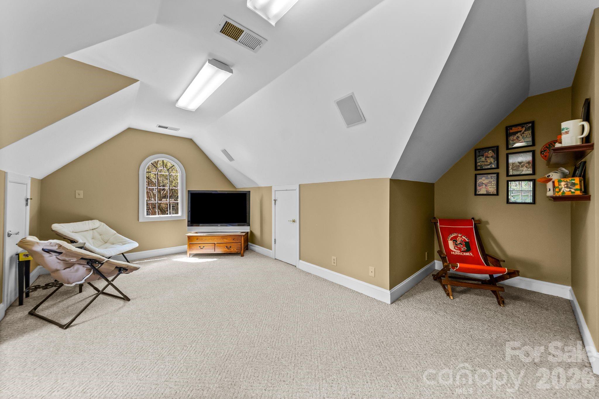 3530 Cardiff Lane Matthews, NC 28104 - Photo 33 of 39 a living room with furniture and a flat screen tv