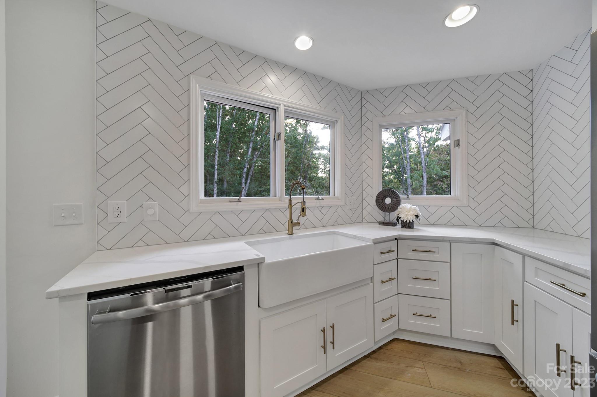 25068 Timberlake Drive Tega Cay, SC 29708 - Photo 13 of 48 a kitchen with a sink stove and cabinets