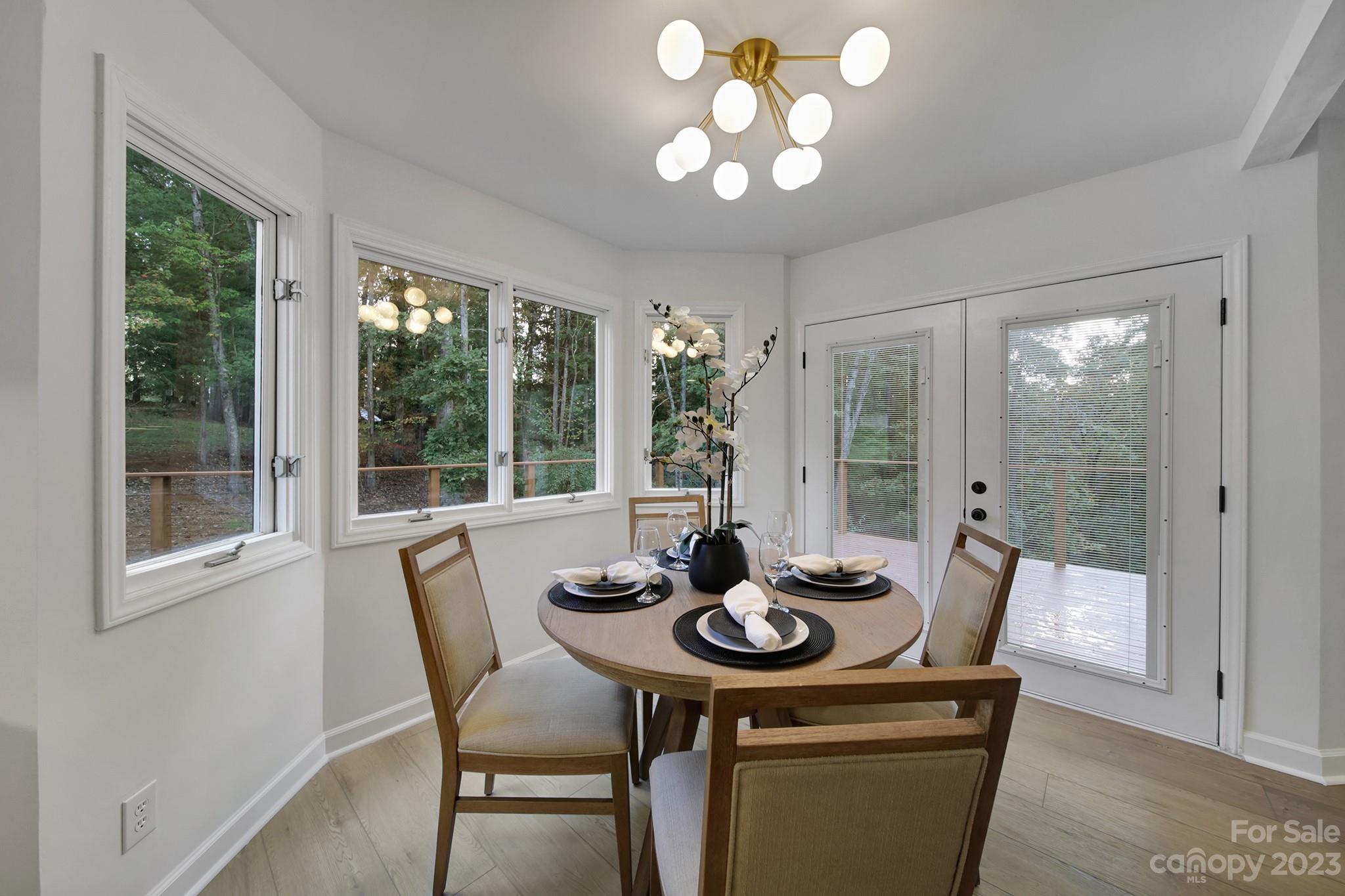 25068 Timberlake Drive Tega Cay, SC 29708 - Photo 16 of 48 a view of a dining room with furniture window and outside view
