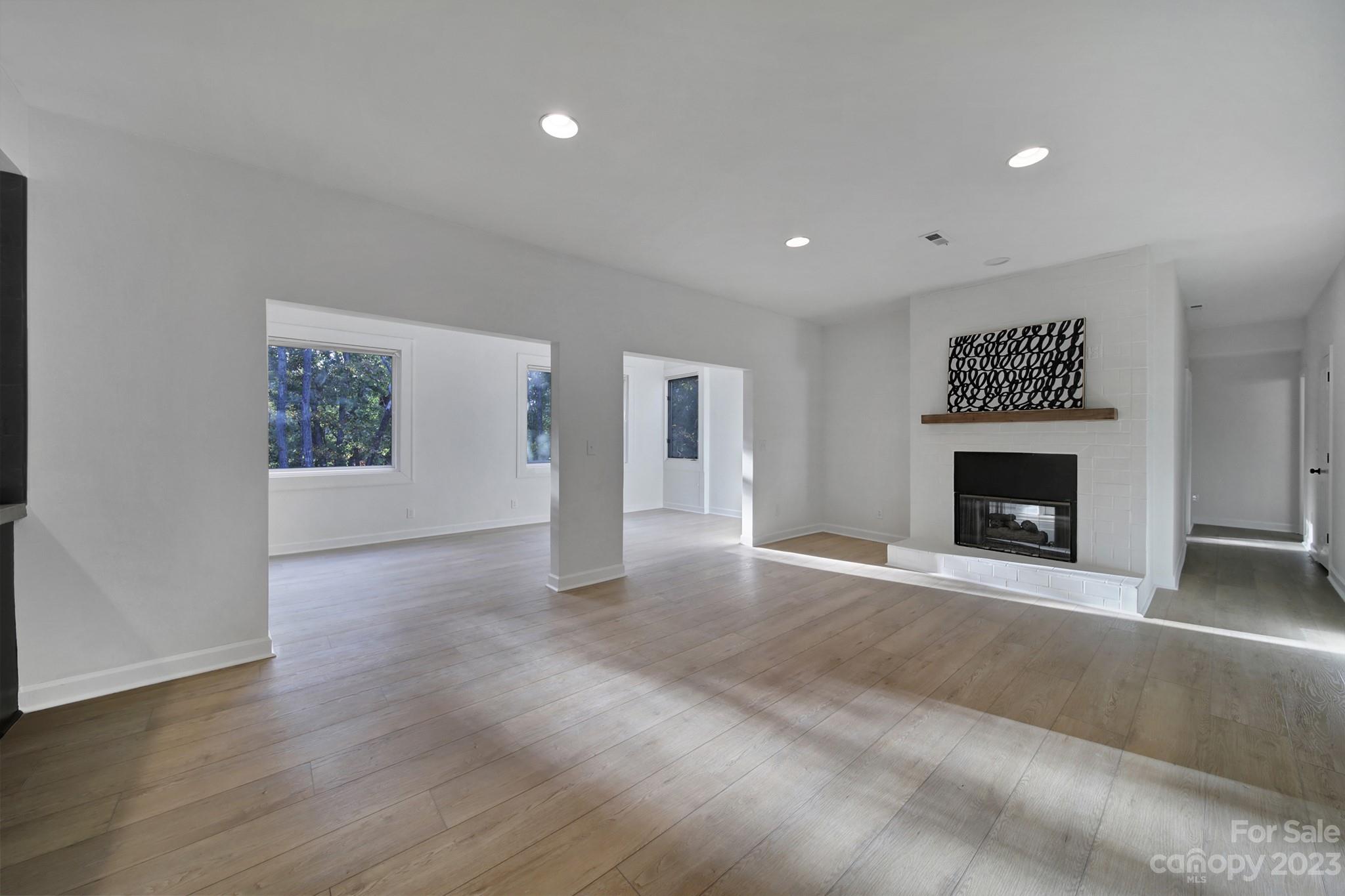25068 Timberlake Drive Tega Cay, SC 29708 - Photo 20 of 48 a view of an empty room with a fireplace