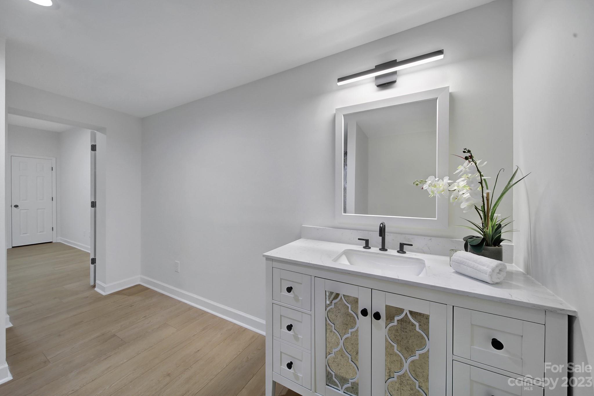 25068 Timberlake Drive Tega Cay, SC 29708 - Photo 29 of 48 a bathroom with a sink and a mirror