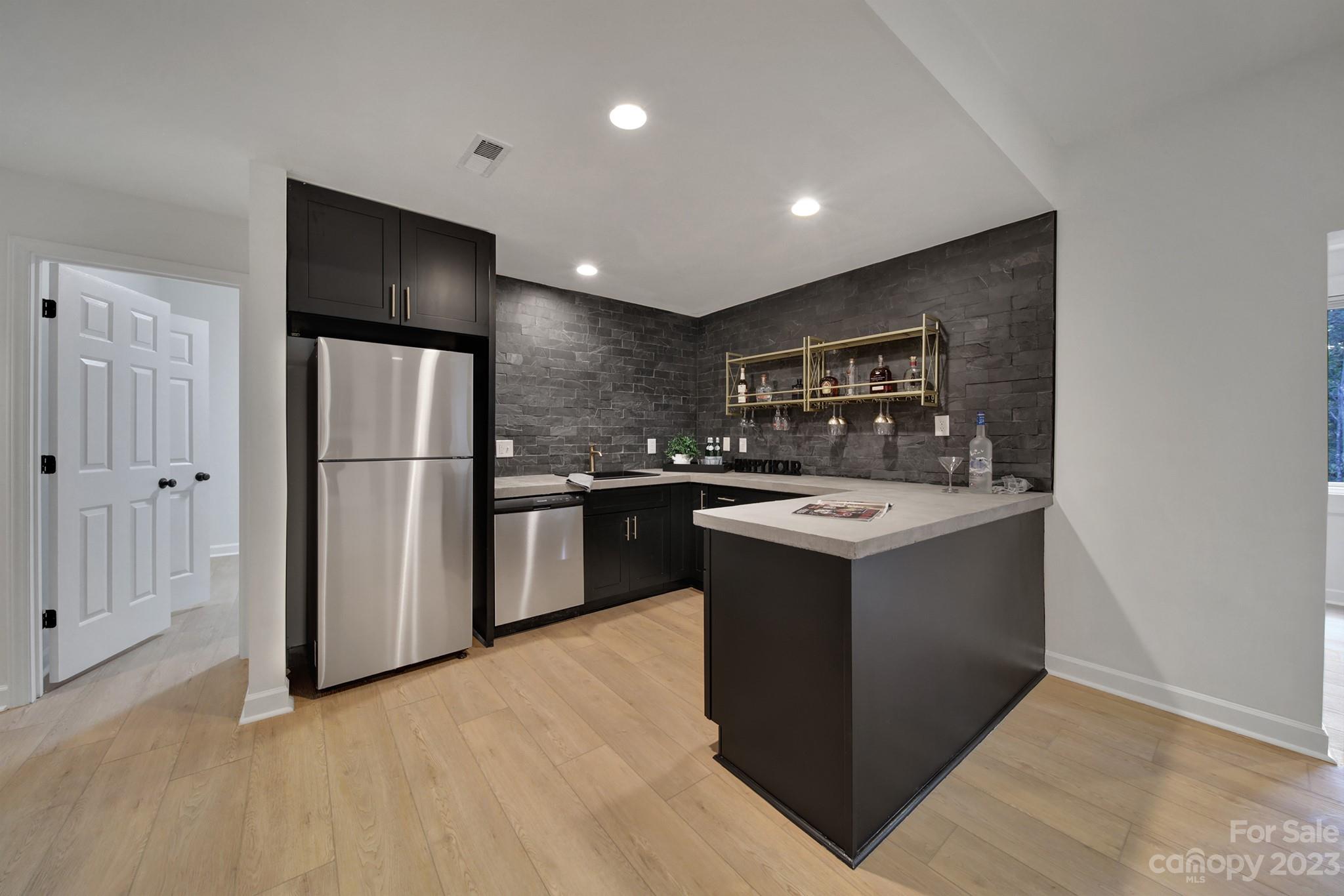 25068 Timberlake Drive Tega Cay, SC 29708 - Photo 30 of 48 a view of a kitchen counter space and stainless steel appliances