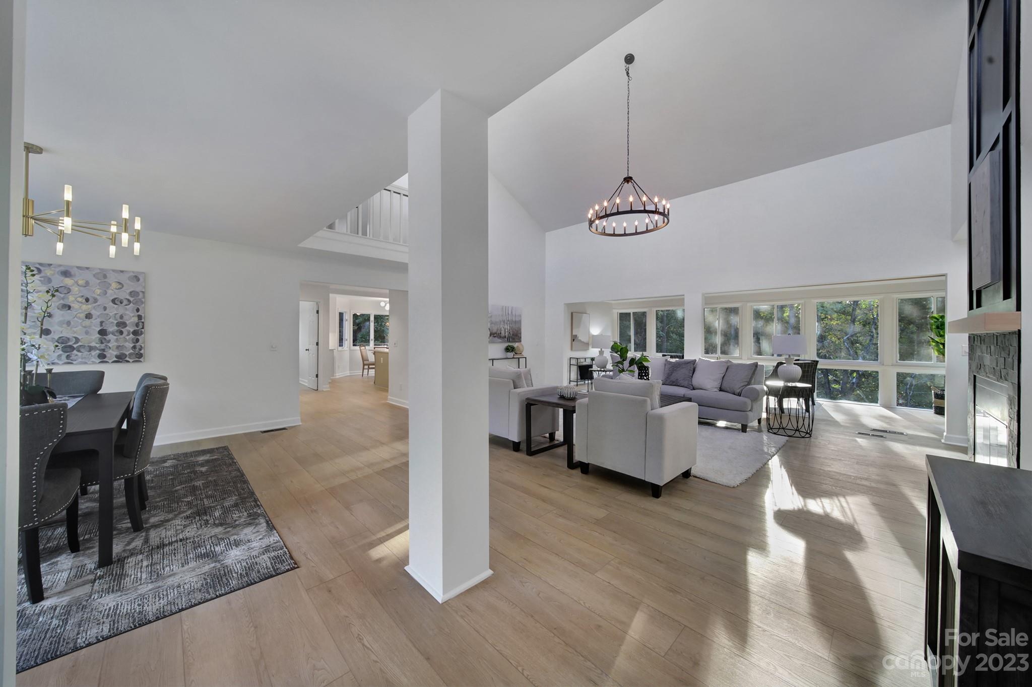 25068 Timberlake Drive Tega Cay, SC 29708 - Photo 3 of 48 a living room with furniture and a chandelier