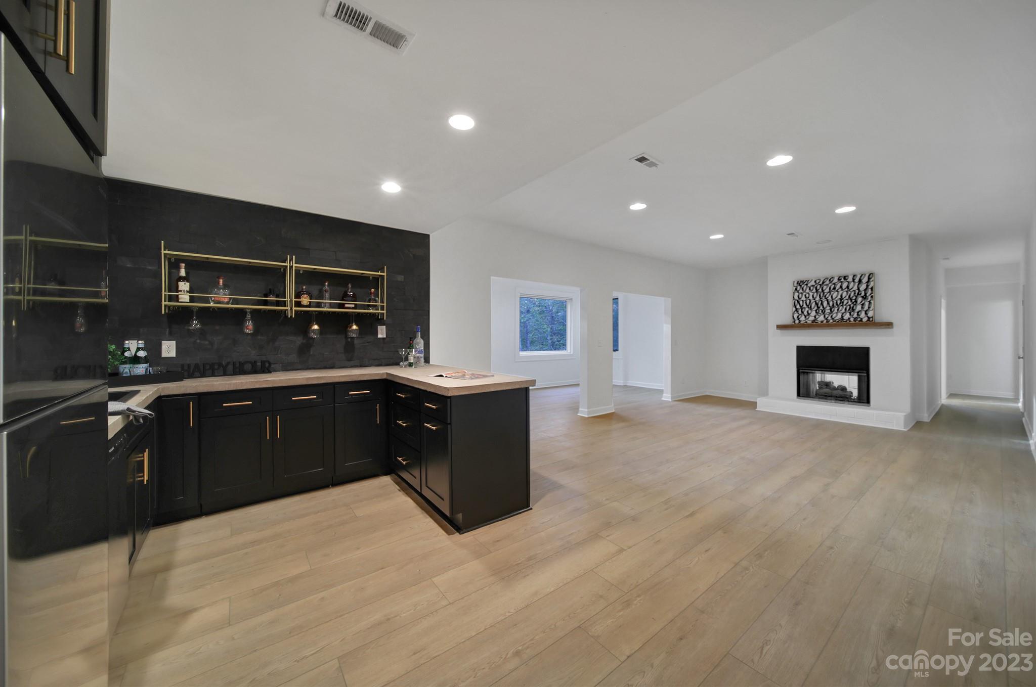 25068 Timberlake Drive Tega Cay, SC 29708 - Photo 33 of 48 a kitchen with stainless steel appliances granite countertop a refrigerator a stove a sink and a oven