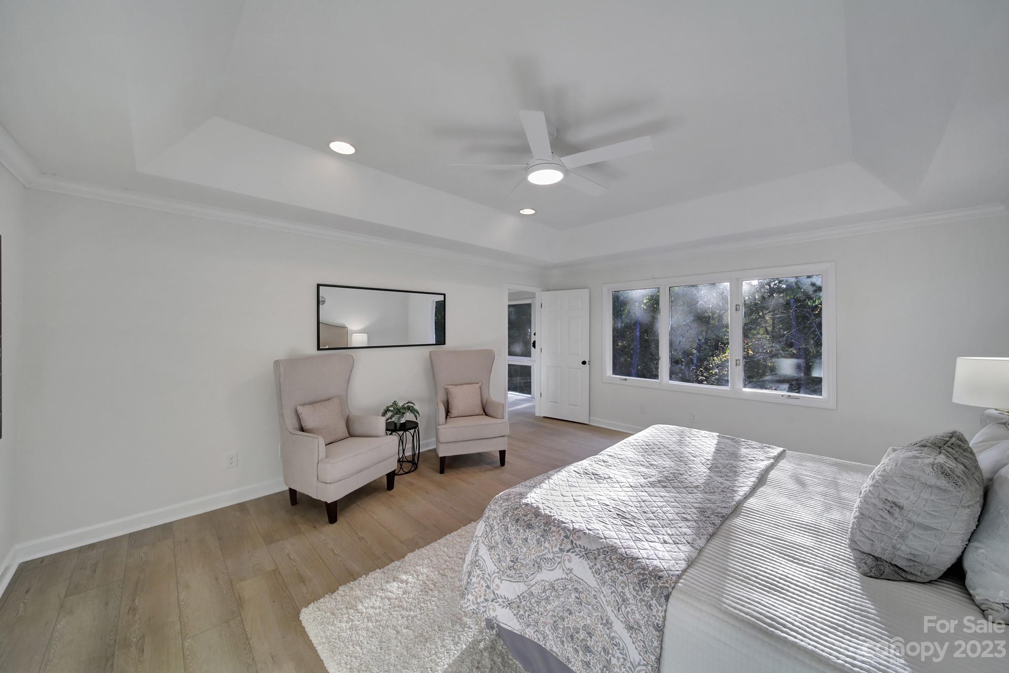 25068 Timberlake Drive Tega Cay, SC 29708 - Photo 35 of 48 a bedroom with furniture and a large window