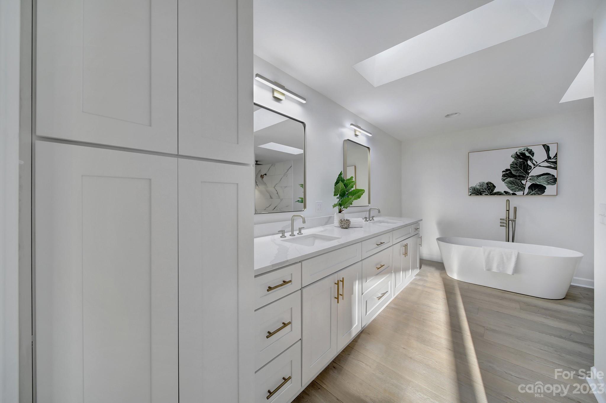 25068 Timberlake Drive Tega Cay, SC 29708 - Photo 37 of 48 a spacious bathroom with a double vanity sink and a large mirror