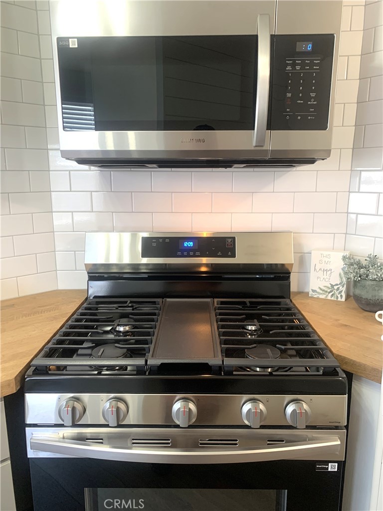 975 California Street, Unit 72 Calimesa, CA 92320 - Photo 15 of 23 a stove top oven sitting inside of a kitchen