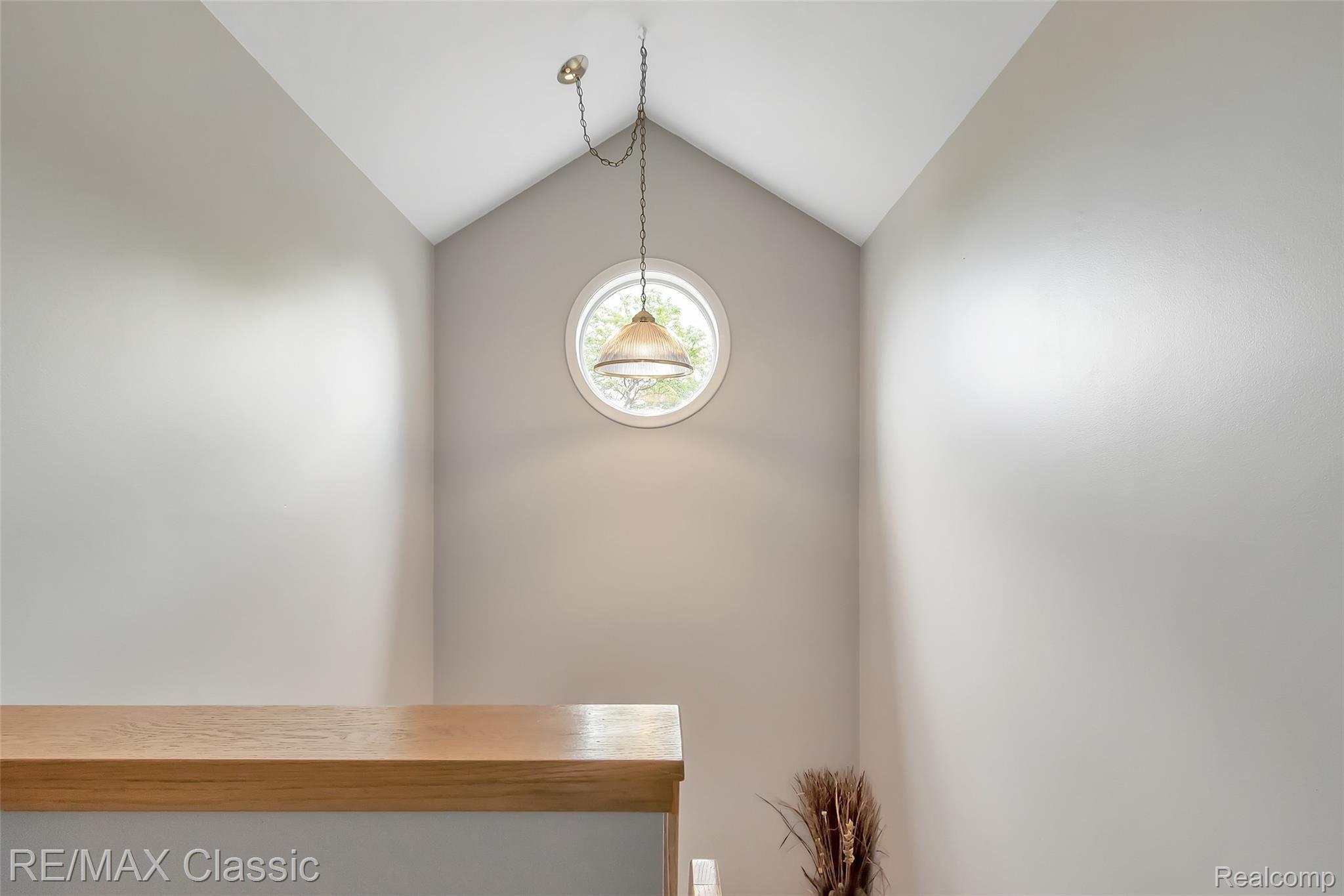 3344 Rivers Edge Drive Wayne, MI 48184 - Photo 26 of 50 Stairway to the upper level... wonderful porthole window for natural lighting.