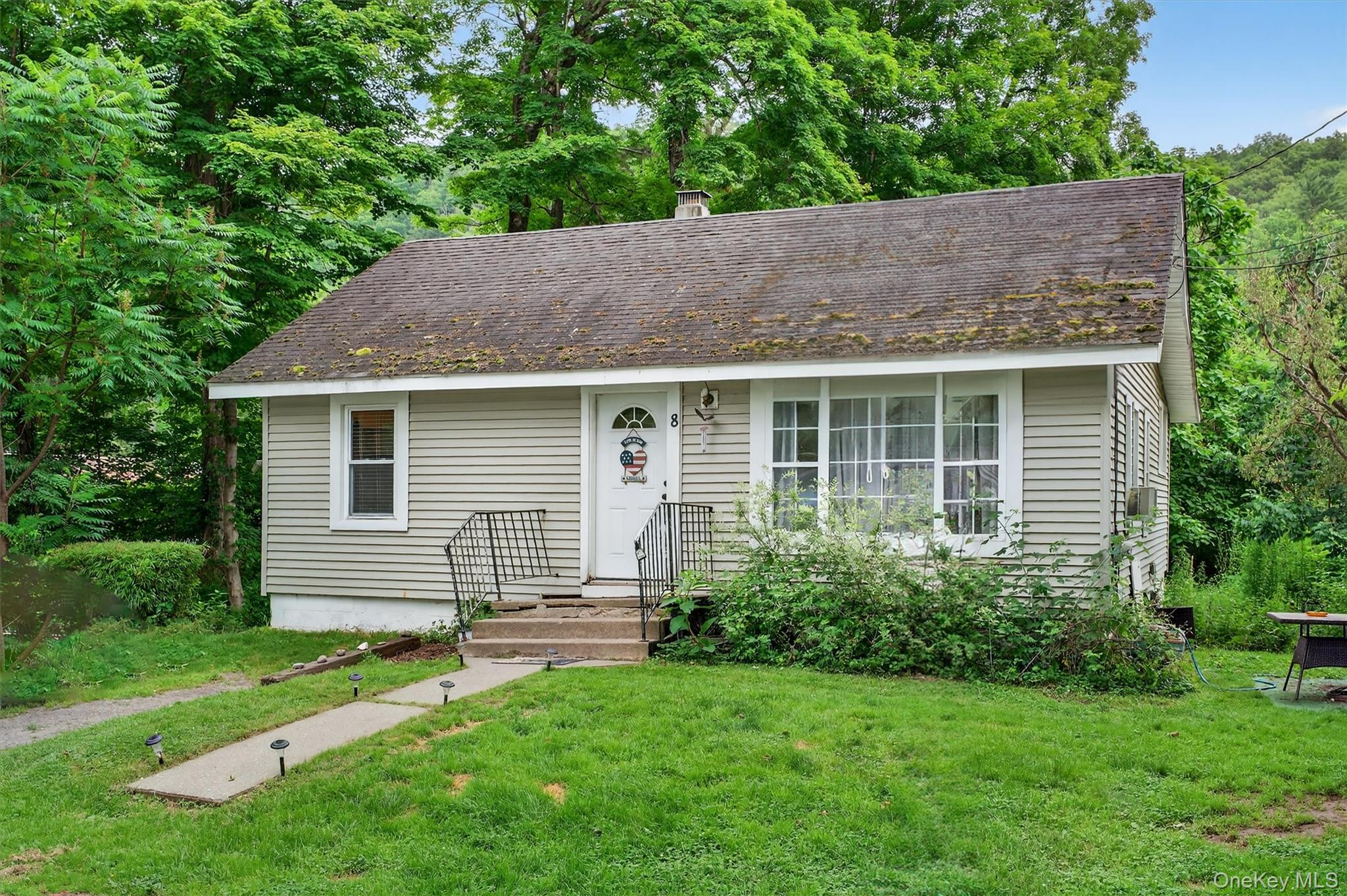a house view with a garden space