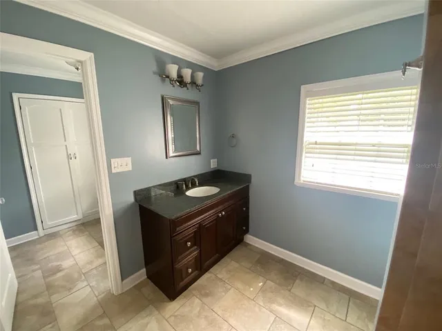 a kitchen with a stove and a cabinet