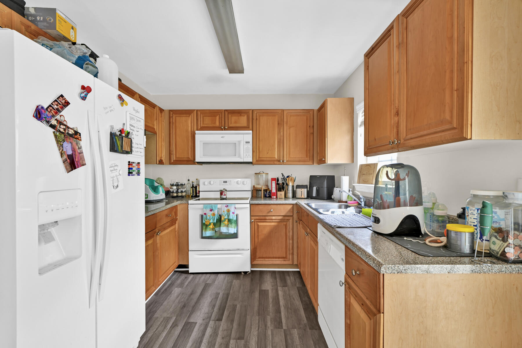 562 Wingspan Way Crestview, FL 32536 - Photo 12 of 23 a kitchen with stainless steel appliances granite countertop a refrigerator and a stove top oven
