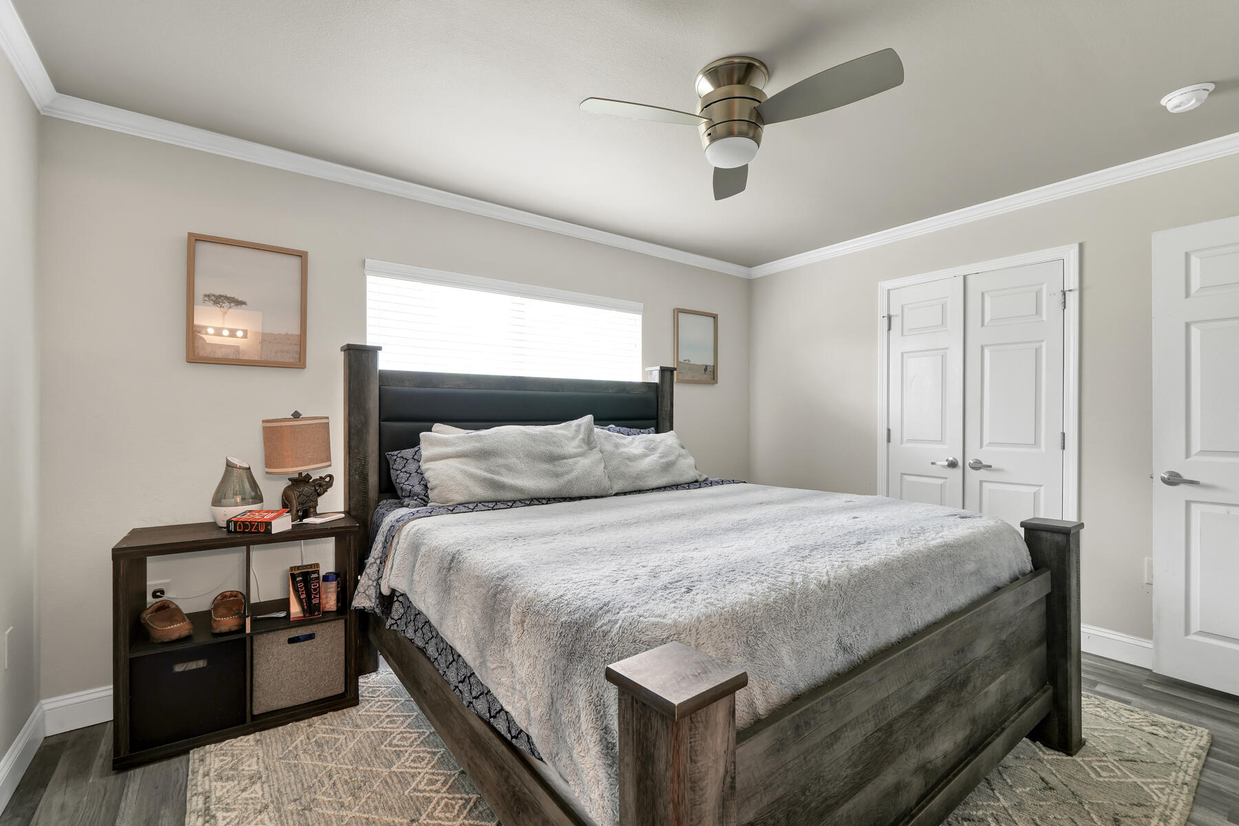 562 Wingspan Way Crestview, FL 32536 - Photo 3 of 23 a bedroom with bed and a chandelier