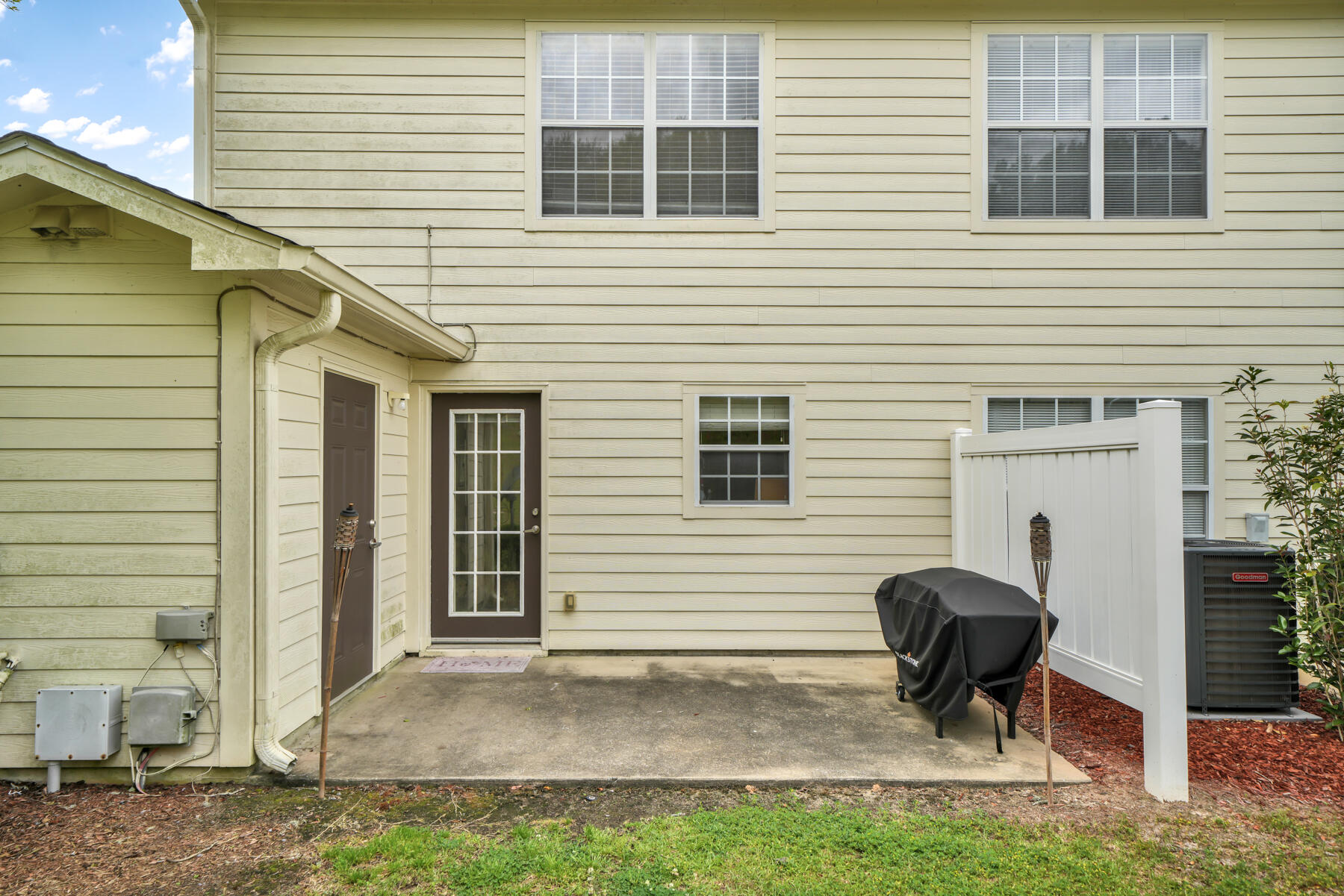 562 Wingspan Way Crestview, FL 32536 - Photo 8 of 23 a view of a house with a patio and a yard