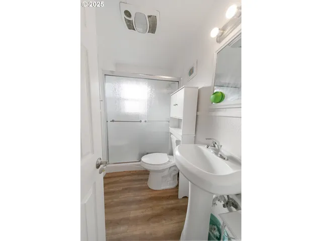 a utility room with dryer washer and a window