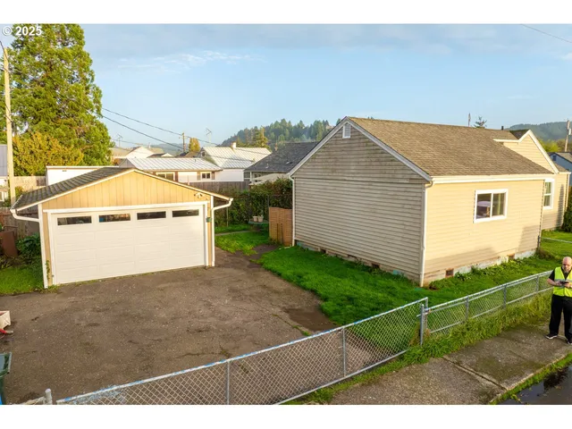 an aerial view of a house with a garden