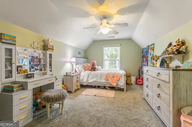 a bedroom with bed and window