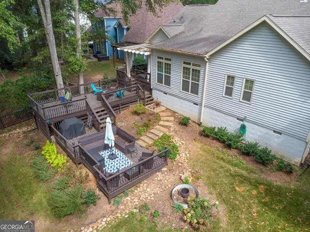 a view of a backyard with plants and a patio
