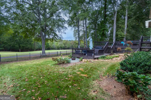 a view of a chair and tables in the garden