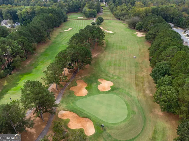 an aerial view of a house with yard swimming pool and outdoor seating