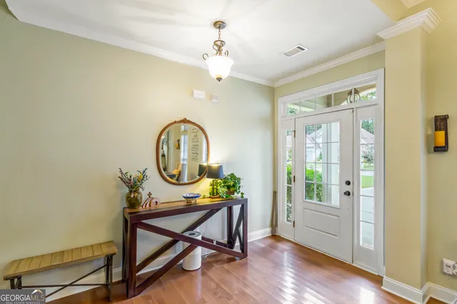 a view of a workspace with furniture window and wooden floor
