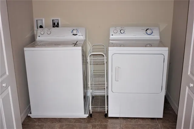 a utility room with dryer and washer