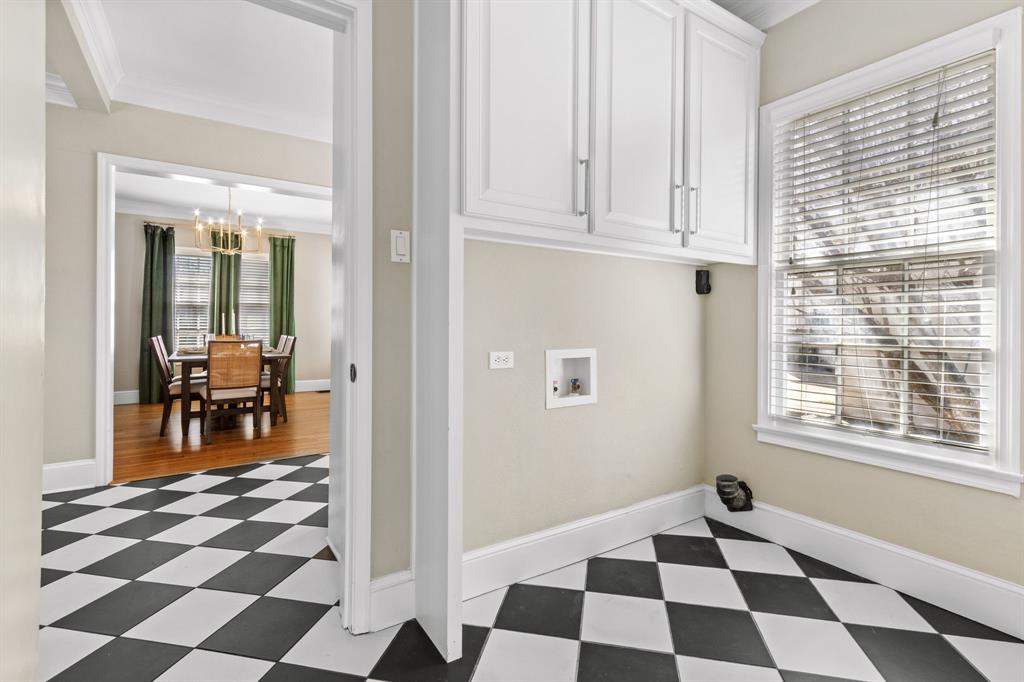 2815 Cumberland Avenue Waco, TX 76708 - Photo 16 of 40 a room with a black white checkered floor and a coffee table