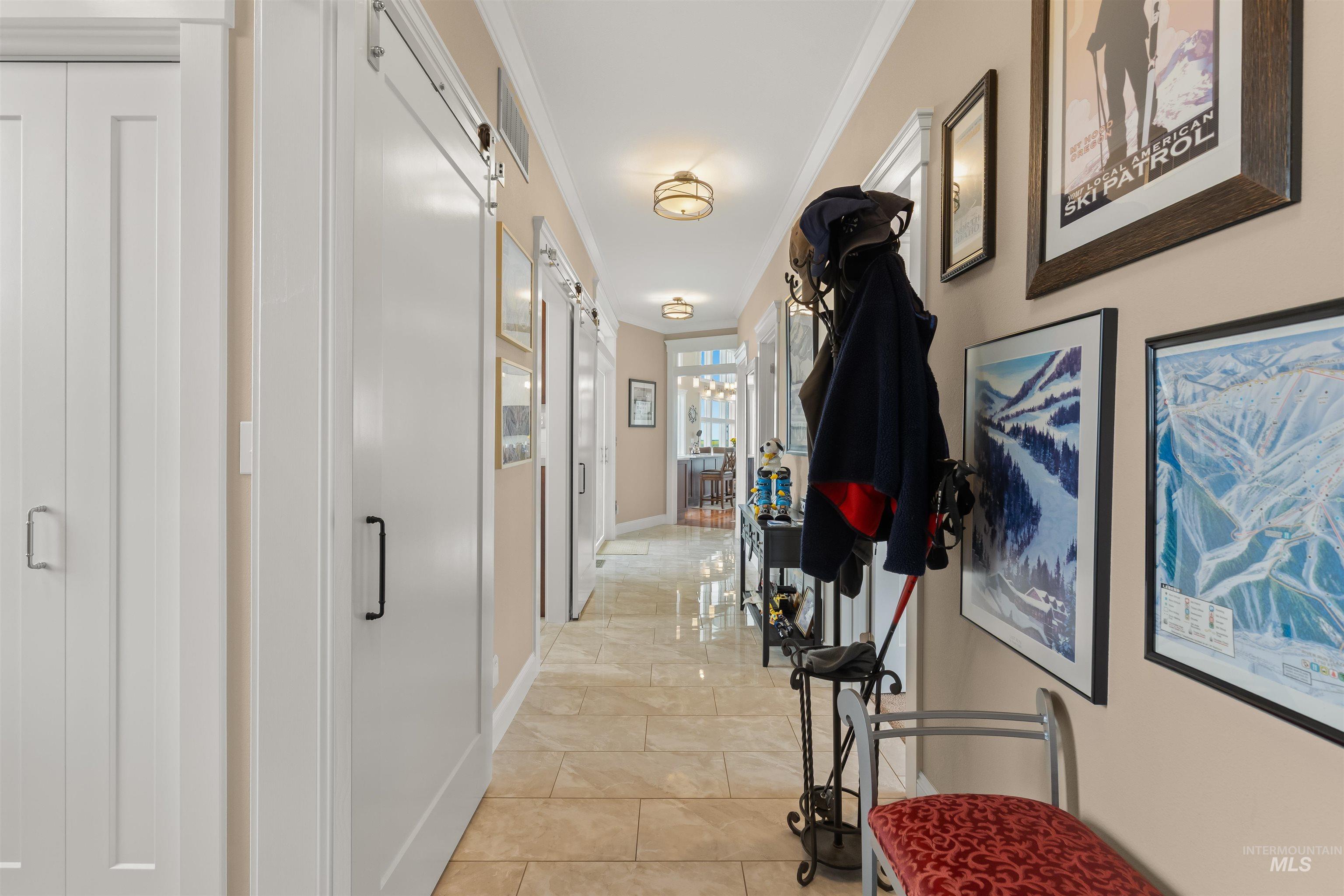 1513 Uniontown Road Genesee, ID 83832 - Photo 23 of 50 Hallway featuring light-toned tile flooring, white crown molding, and recessed lighting