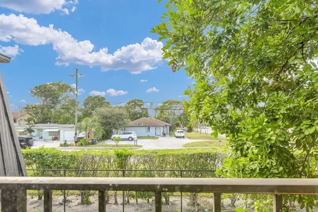 a view of a swimming pool with a yard
