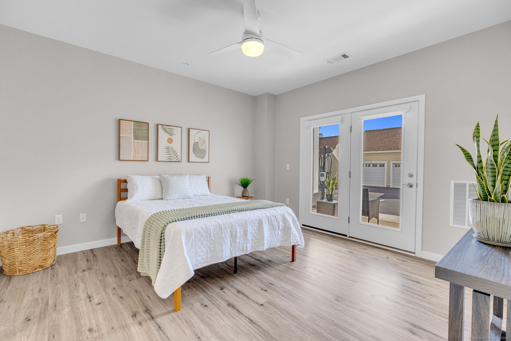 104 Episcopal Road, Unit 1 Berlin, CT 06037 - Photo 12 of 27 a spacious bedroom with a bed and a wooden floor