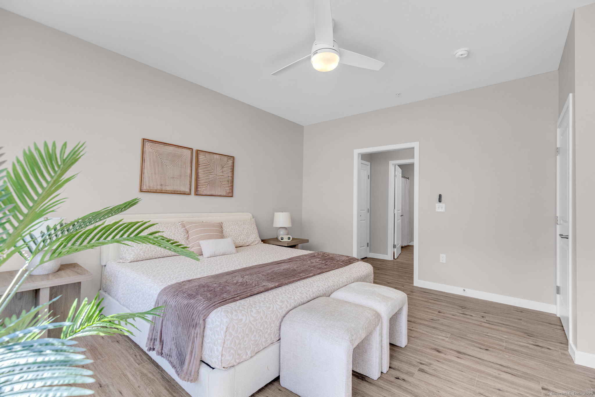 104 Episcopal Road, Unit 1 Berlin, CT 06037 - Photo 20 of 27 a bedroom with a bed and a painting on the wall