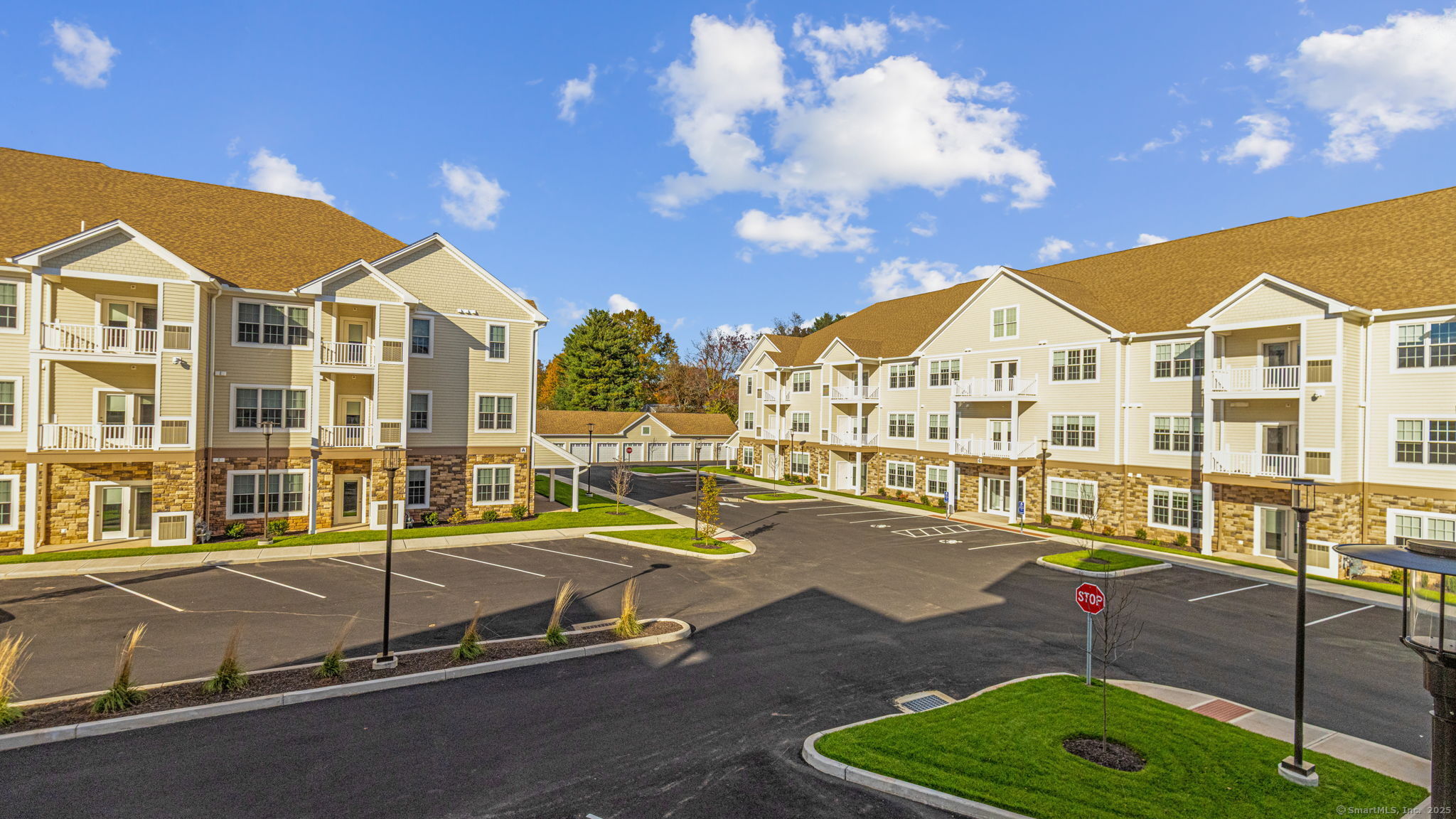 104 Episcopal Road, Unit 1 Berlin, CT 06037 - Photo 2 of 27 a view of a large pool with lawn chairs