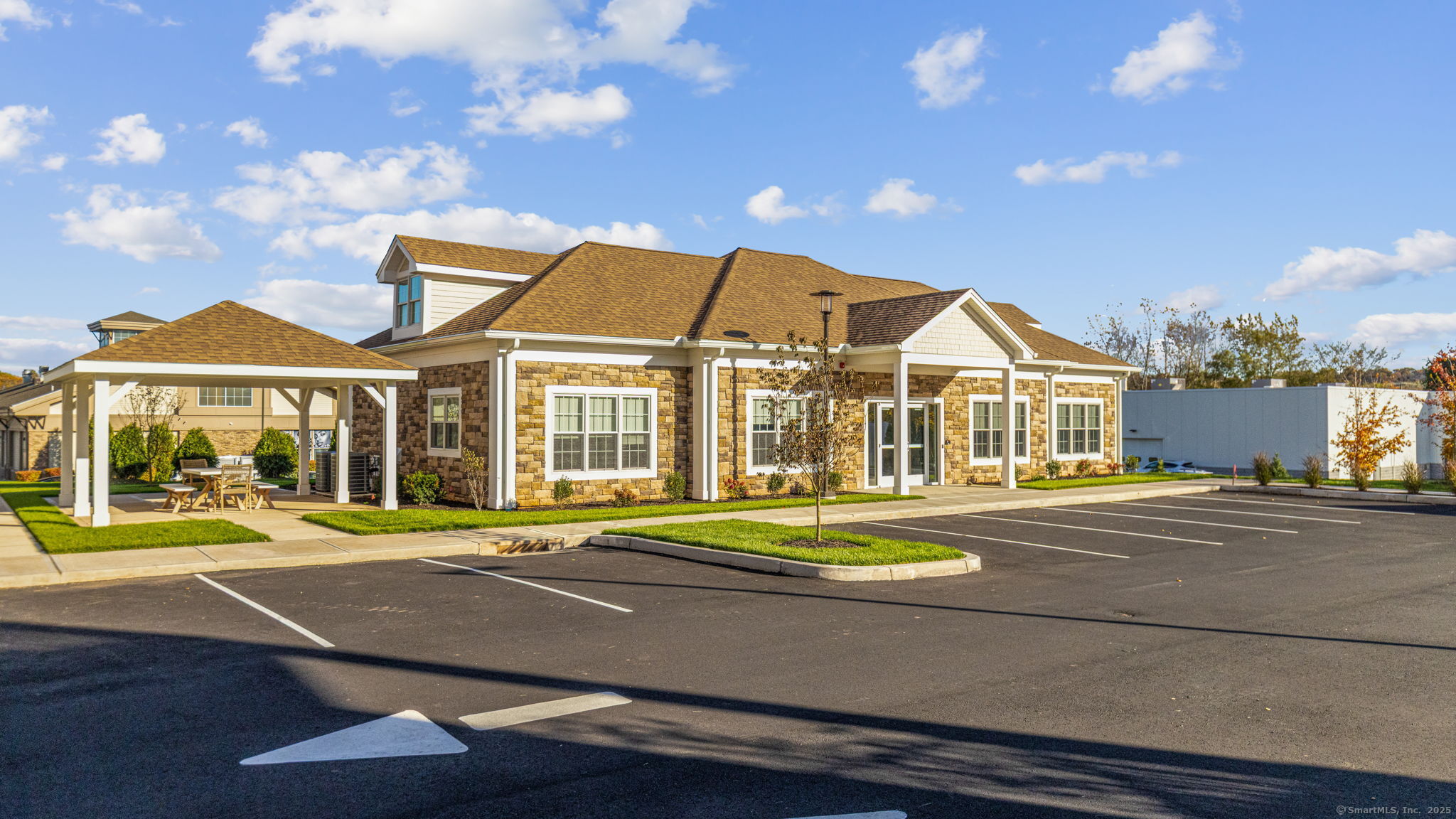 104 Episcopal Road, Unit 1 Berlin, CT 06037 - Photo 3 of 27 a front view of a house with a yard