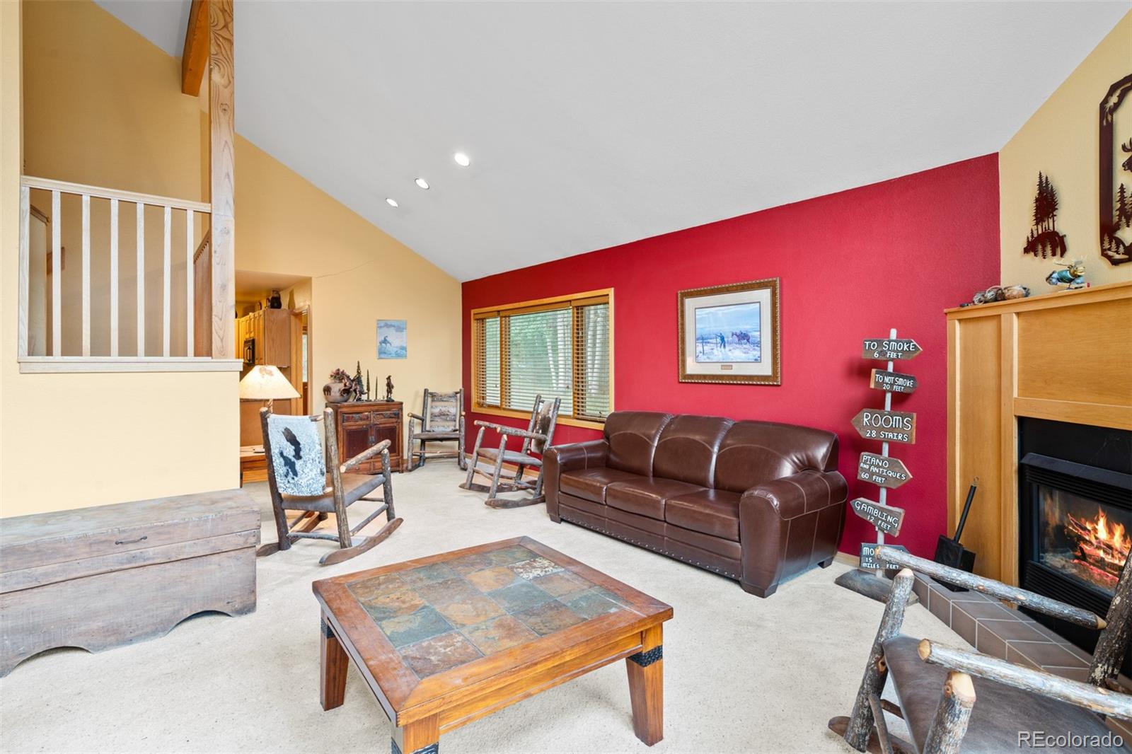 868 Deer Path Road Dillon, CO 80435 - Photo 14 of 50 a living room with furniture a flat screen tv and a fireplace