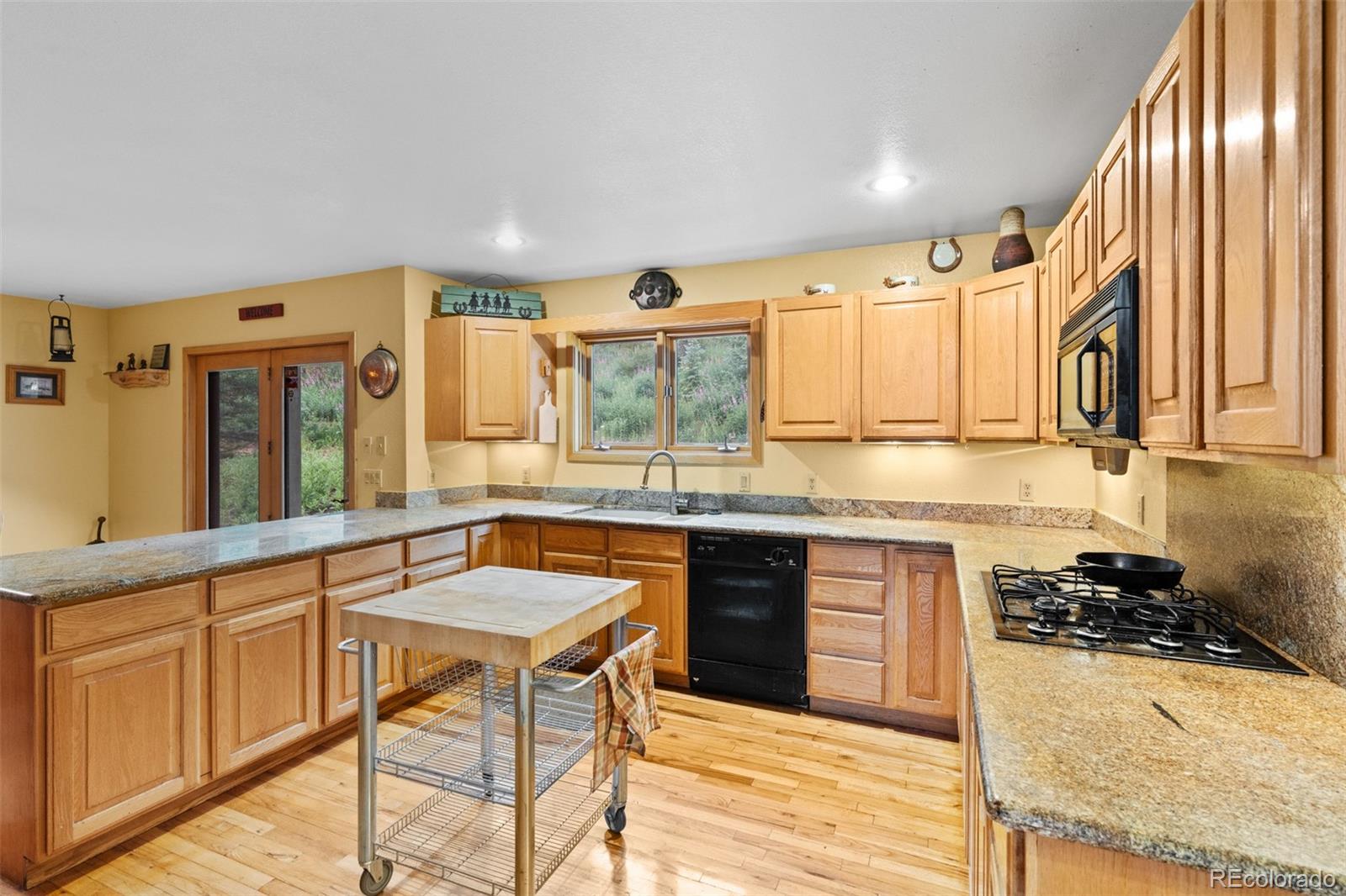 868 Deer Path Road Dillon, CO 80435 - Photo 17 of 50 a kitchen with stainless steel appliances granite countertop a sink stove and cabinets