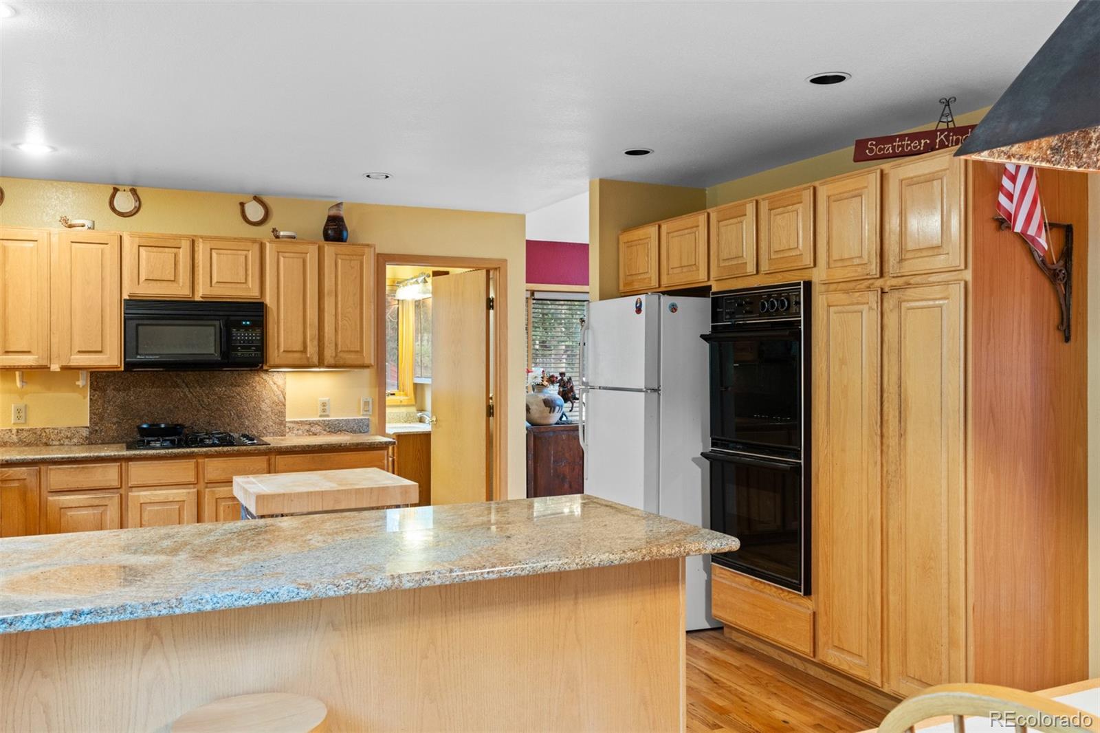 868 Deer Path Road Dillon, CO 80435 - Photo 20 of 50 a kitchen with stainless steel appliances granite countertop a refrigerator and a sink