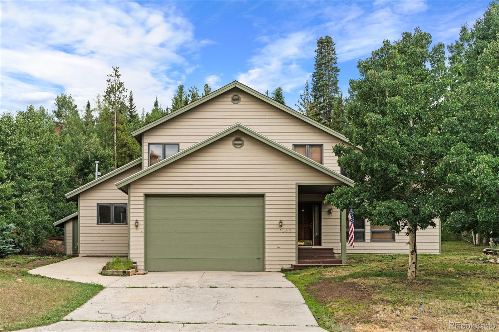 868 Deer Path Road Dillon, CO 80435 - Photo 2 of 50 a front view of a house with a garden
