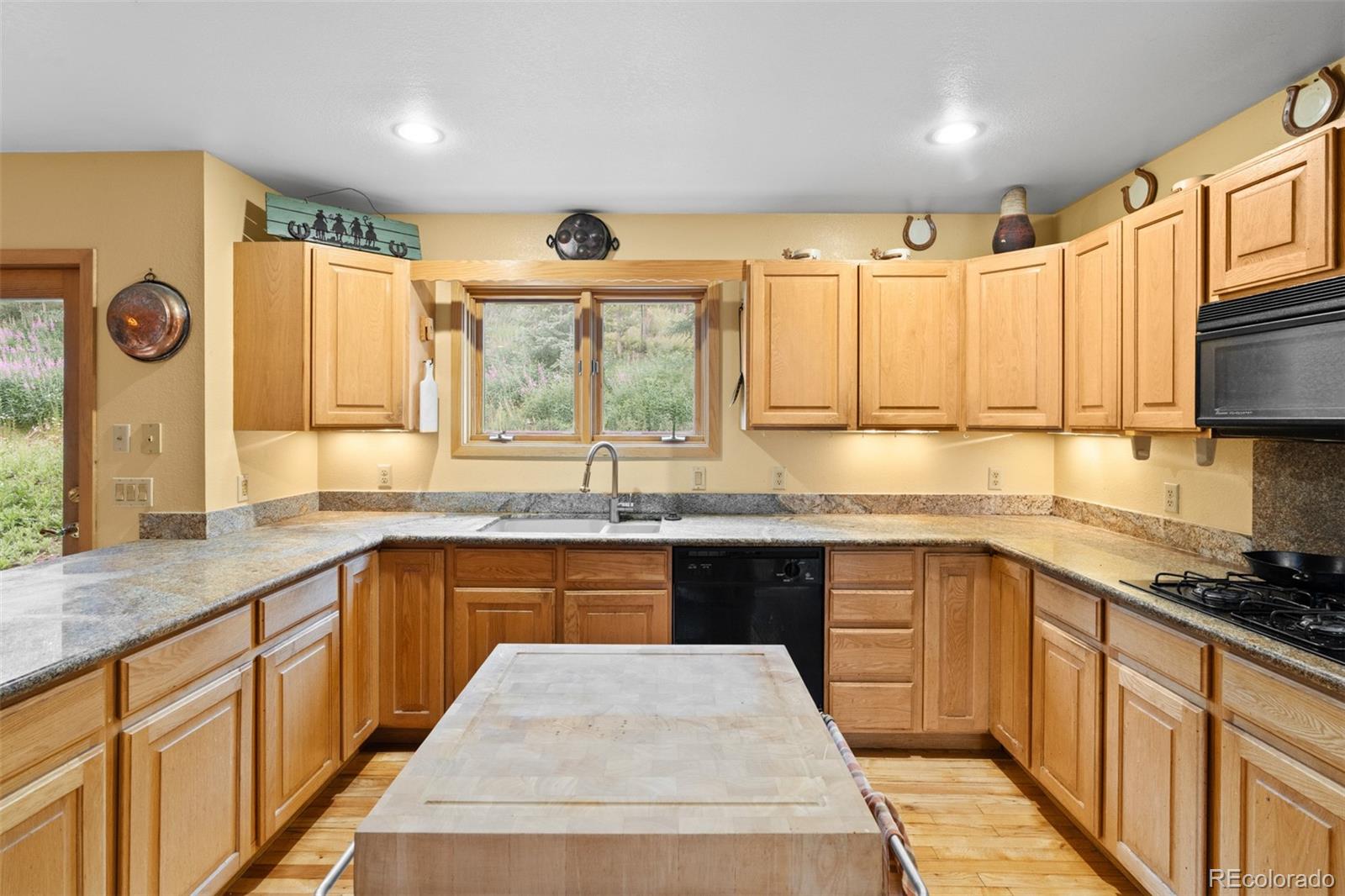 868 Deer Path Road Dillon, CO 80435 - Photo 25 of 50 a kitchen with stainless steel appliances granite countertop a sink and a stove