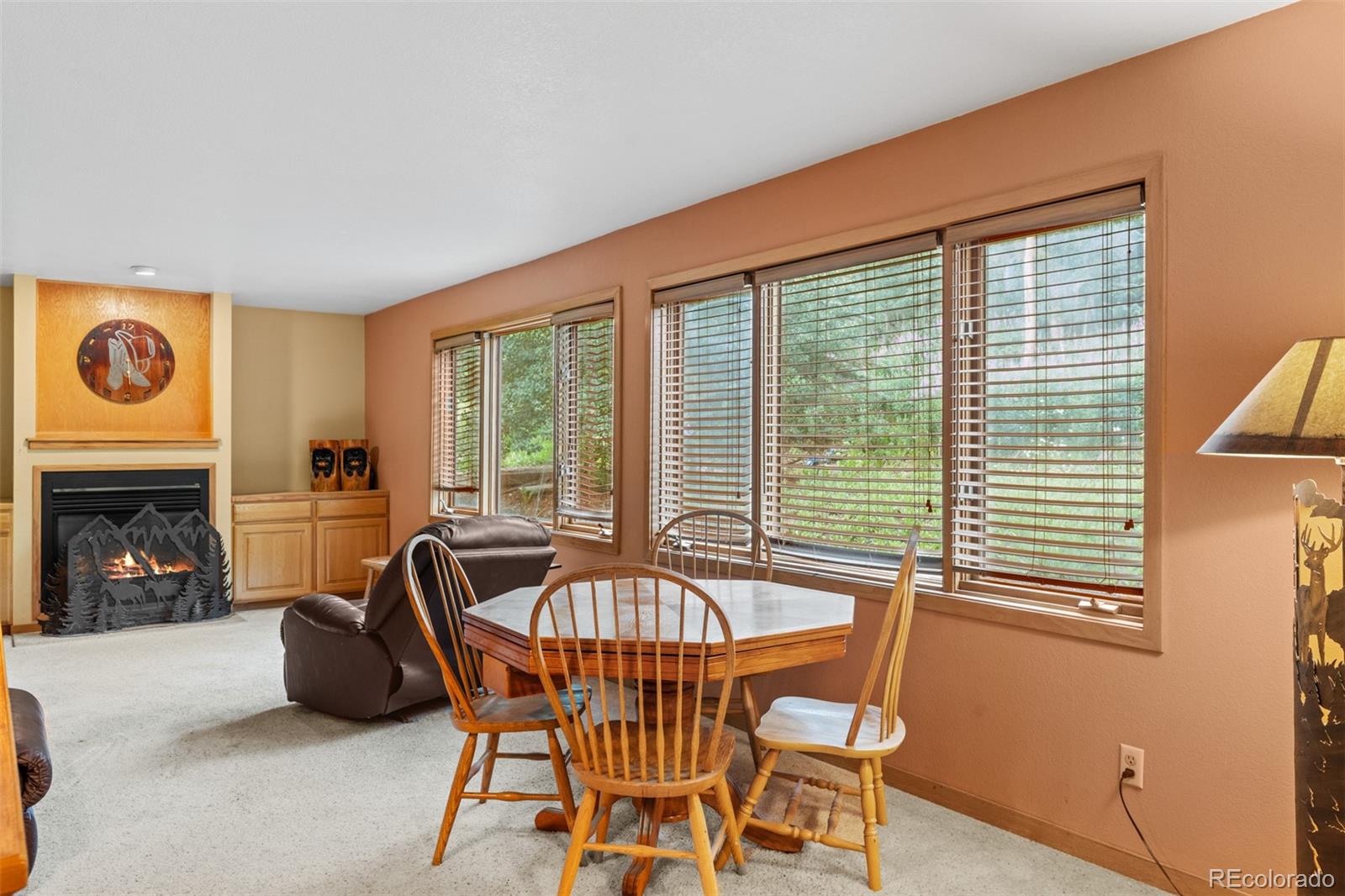 868 Deer Path Road Dillon, CO 80435 - Photo 28 of 50 a dining room with furniture and fireplace
