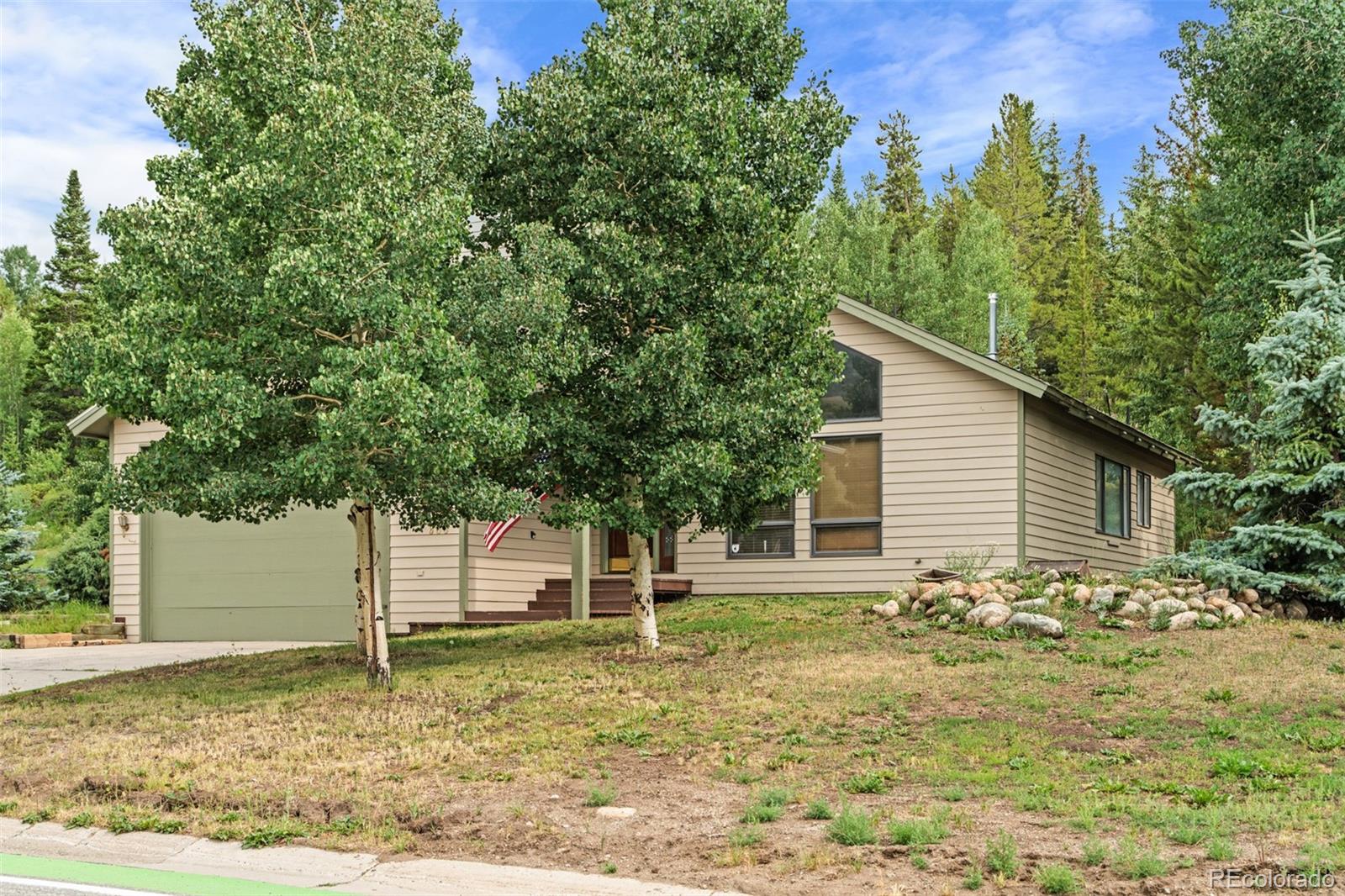 868 Deer Path Road Dillon, CO 80435 - Photo 3 of 50 a front view of a house with a yard