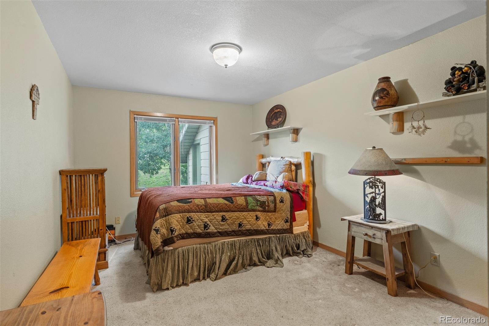 868 Deer Path Road Dillon, CO 80435 - Photo 34 of 50 a bedroom with a bed and a window