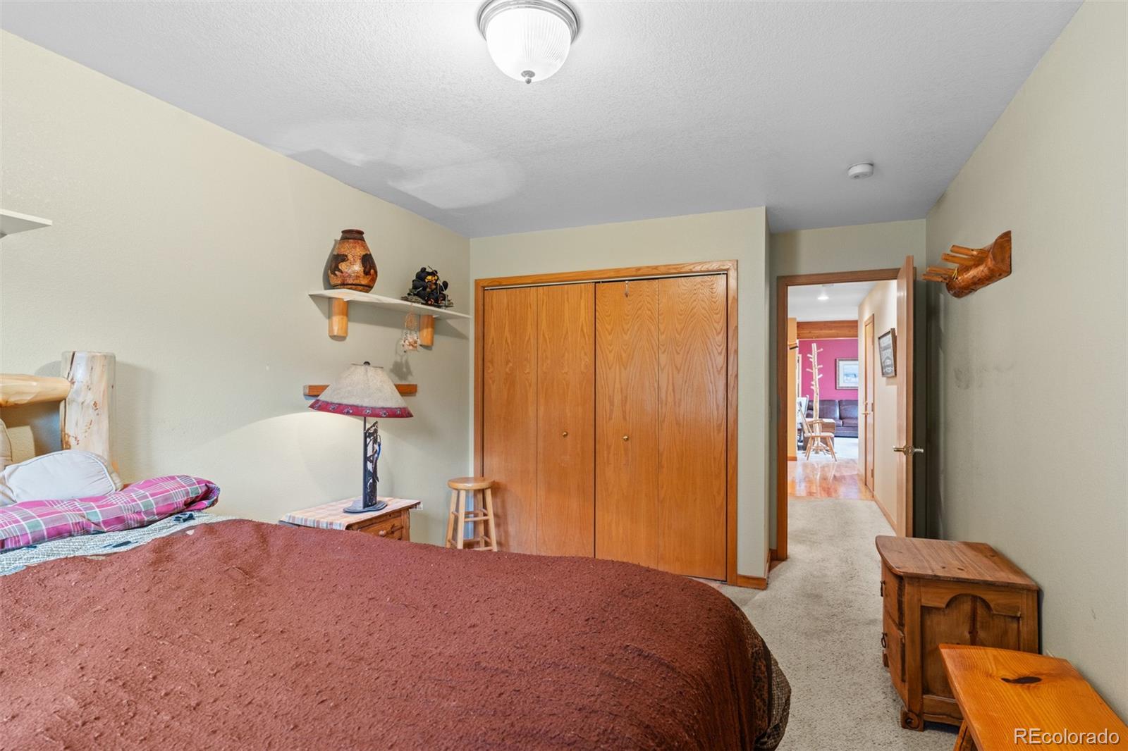868 Deer Path Road Dillon, CO 80435 - Photo 35 of 50 a bedroom with a bed and a window