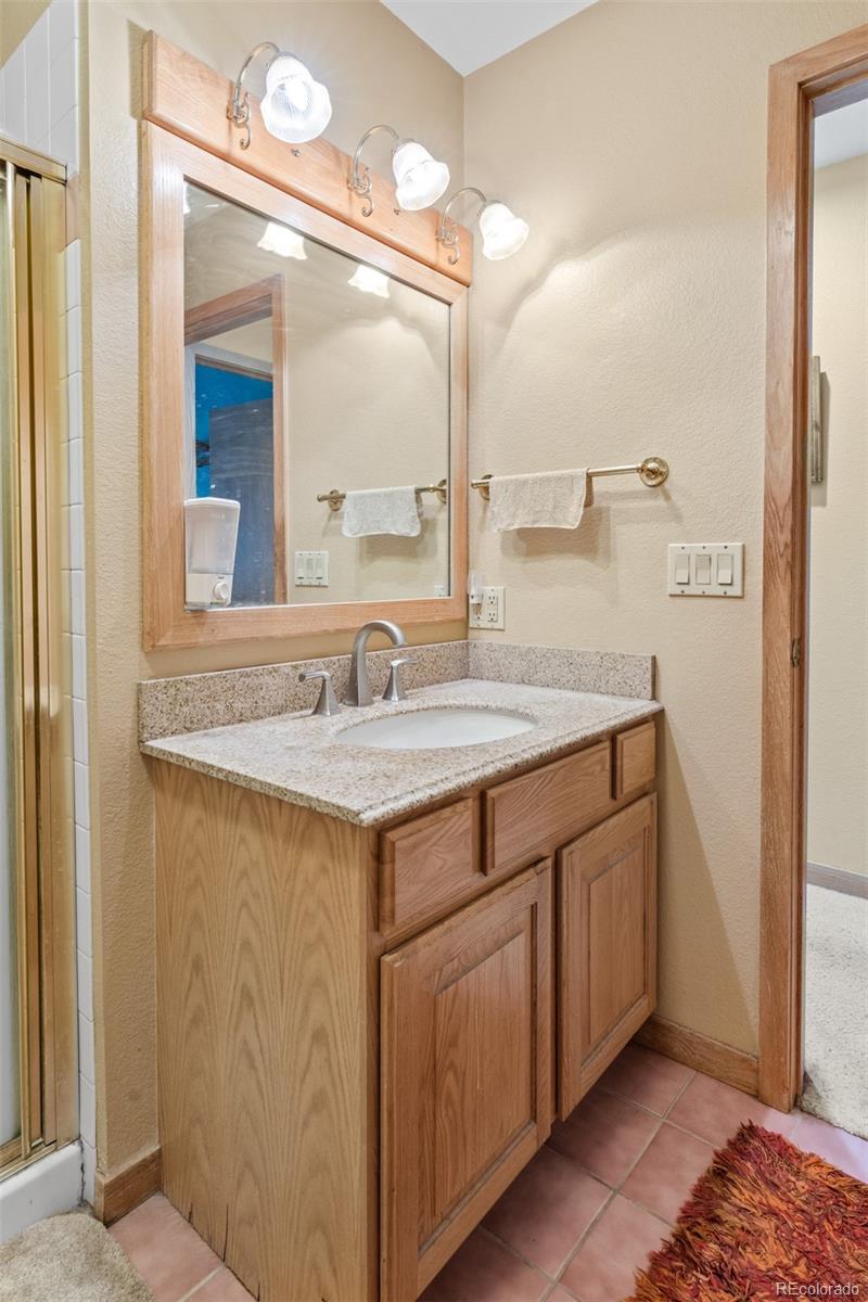 868 Deer Path Road Dillon, CO 80435 - Photo 37 of 50 a bathroom with a sink and a mirror