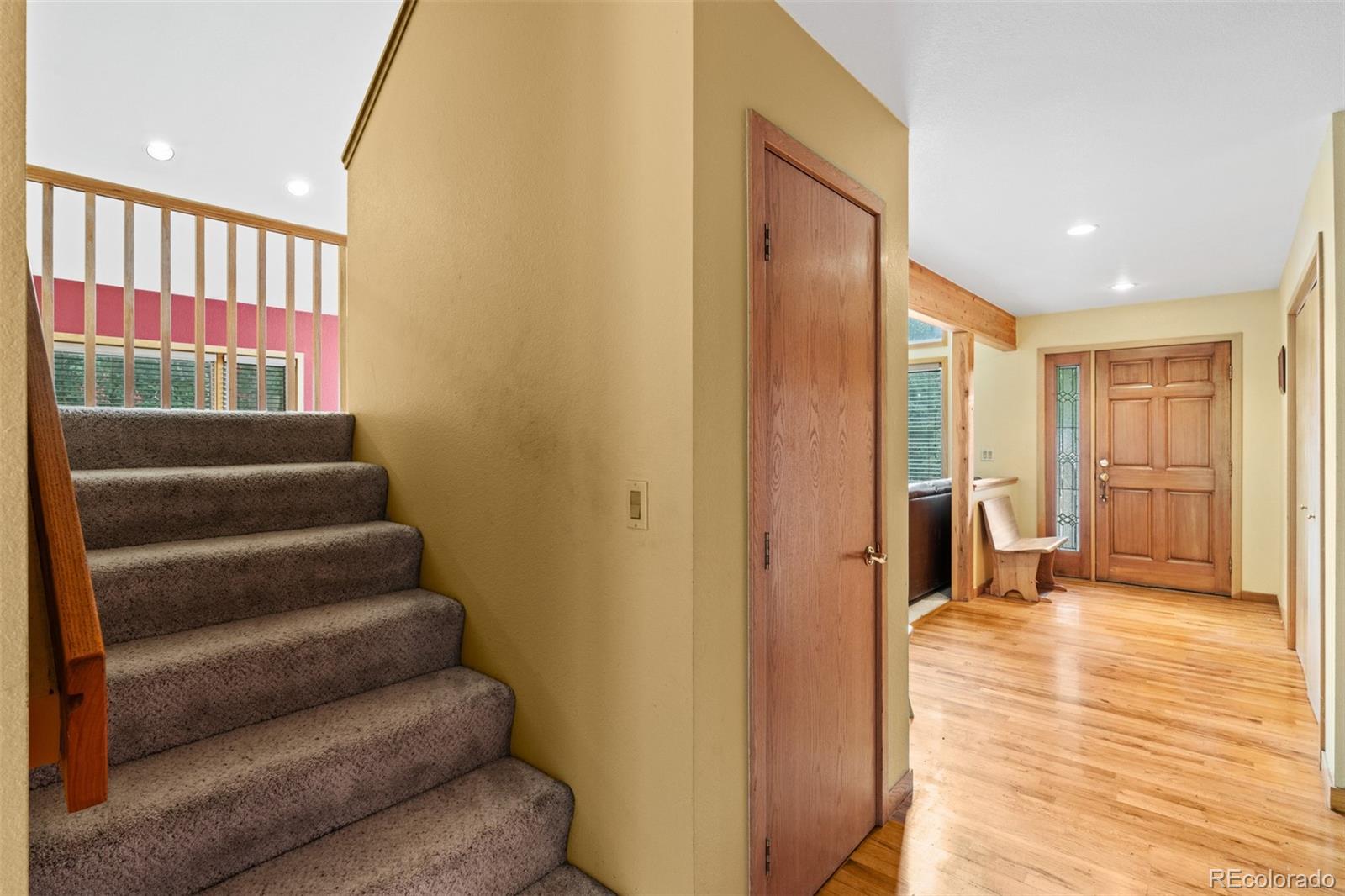 868 Deer Path Road Dillon, CO 80435 - Photo 39 of 50 a view of a hallway with wooden floor and staircase