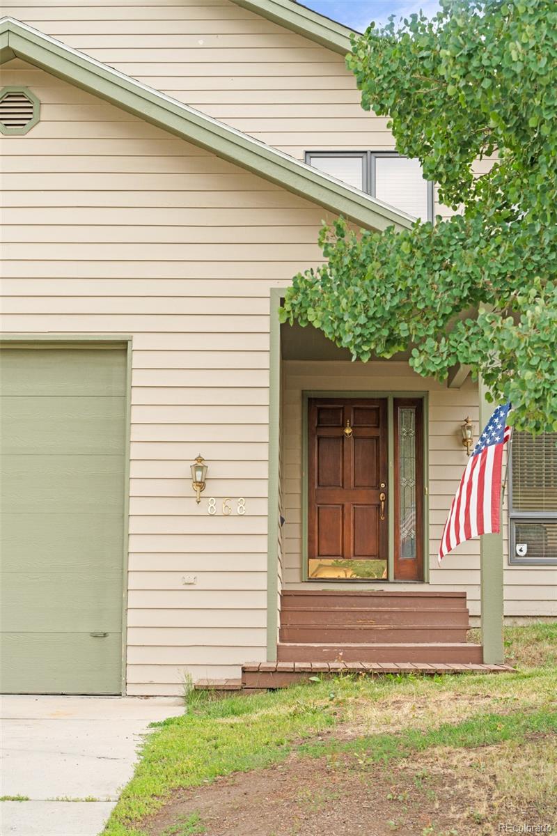 868 Deer Path Road Dillon, CO 80435 - Photo 4 of 50 a view of a house with a small yard and plants