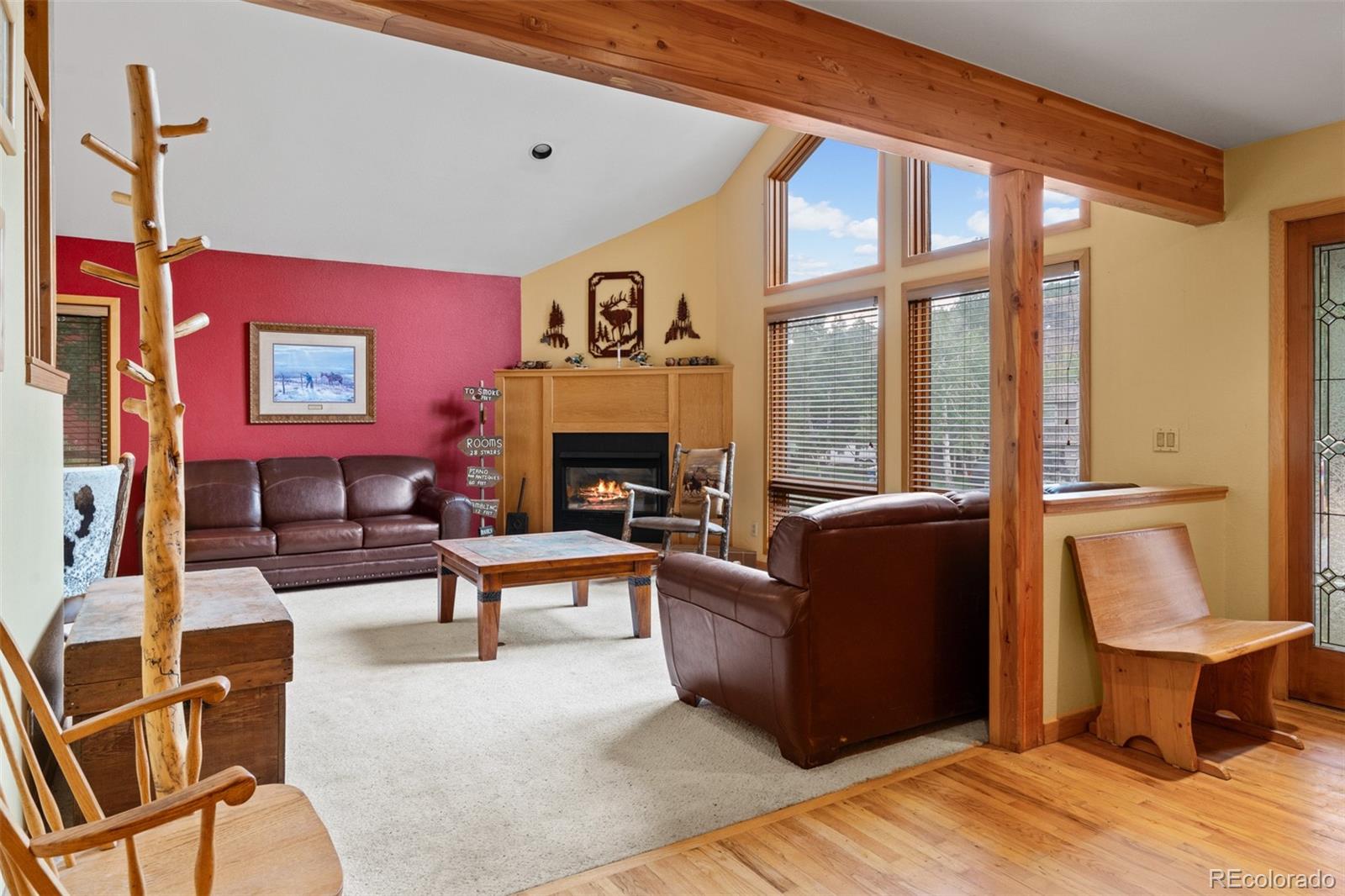 868 Deer Path Road Dillon, CO 80435 - Photo 8 of 50 a living room with furniture a large window and a fireplace